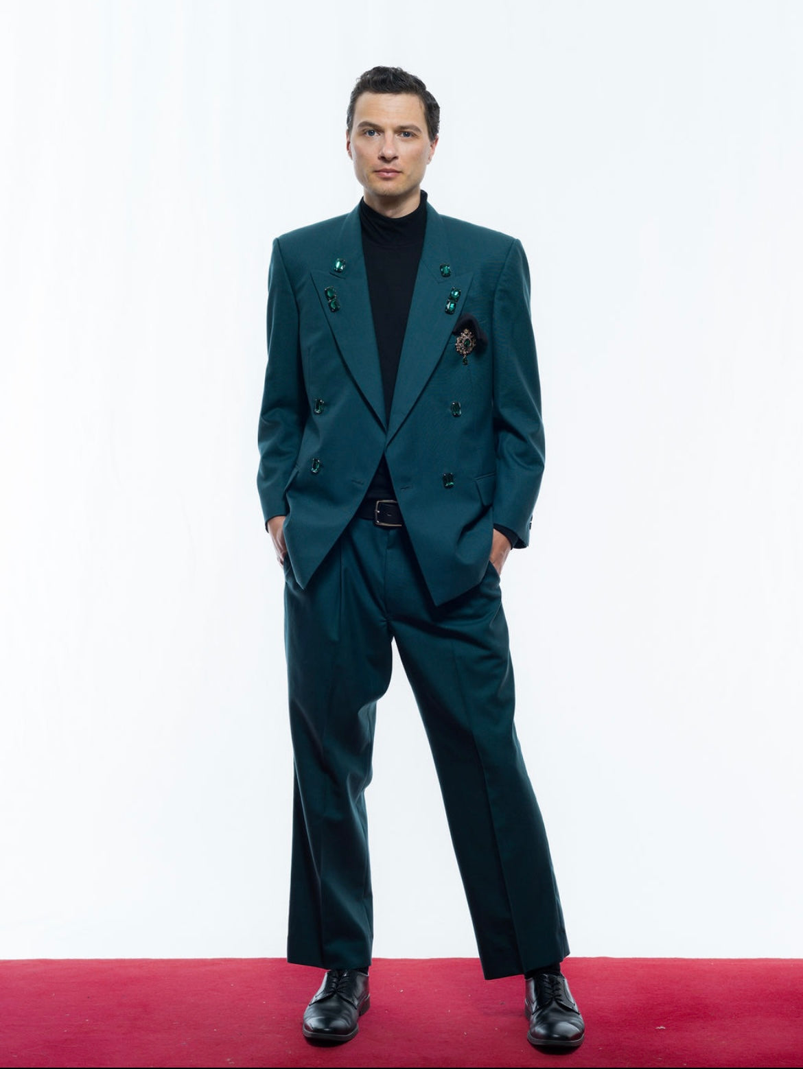 Coloured suit with green gems
