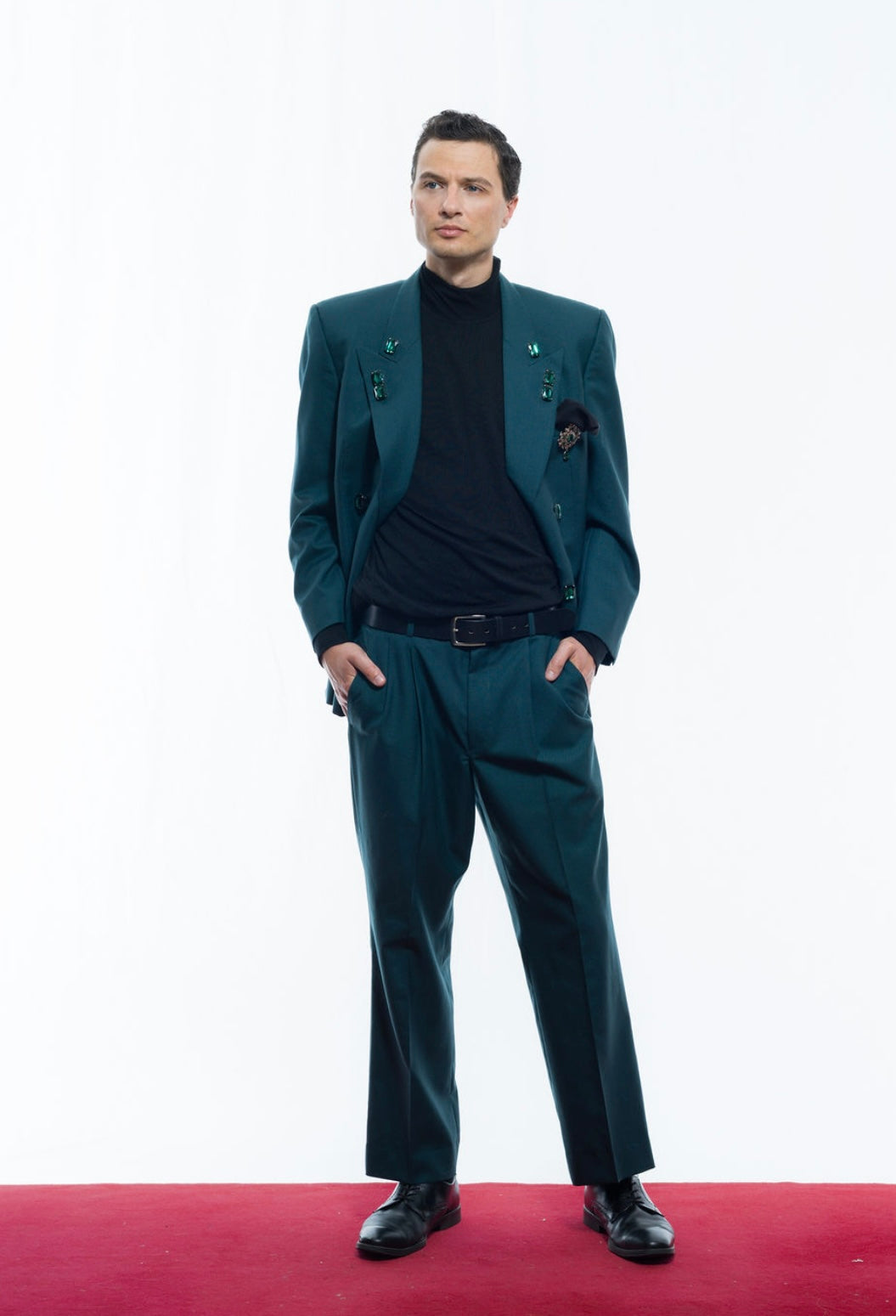 Coloured suit with green gems